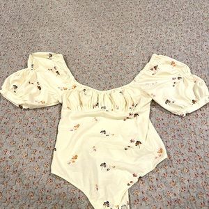 Free People Intimately Floral Bodysuit with puff sleeves.